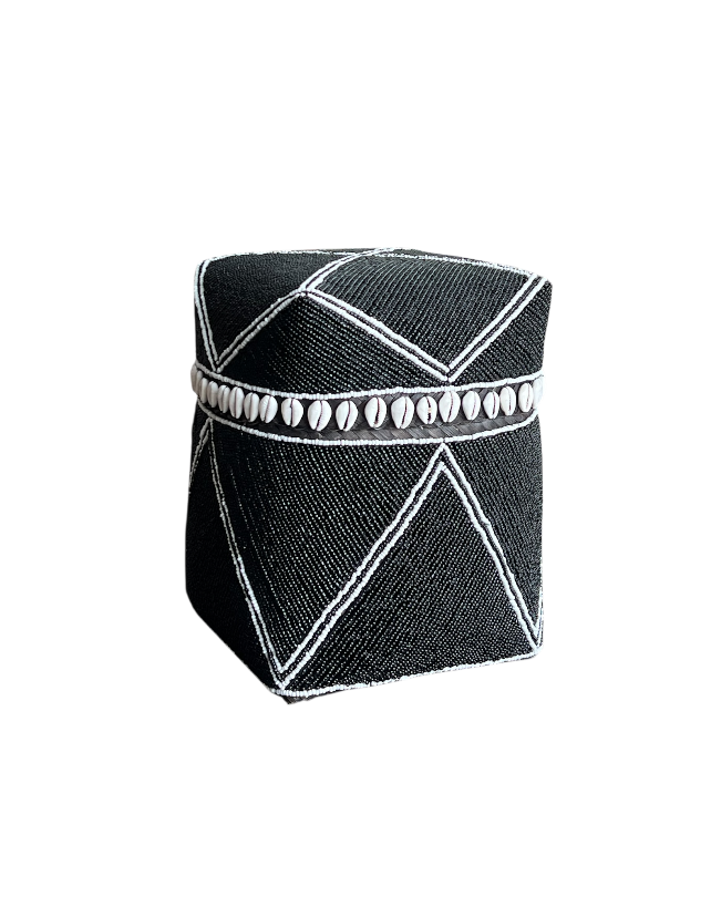 Black geometric-patterned box with white accents on a white background