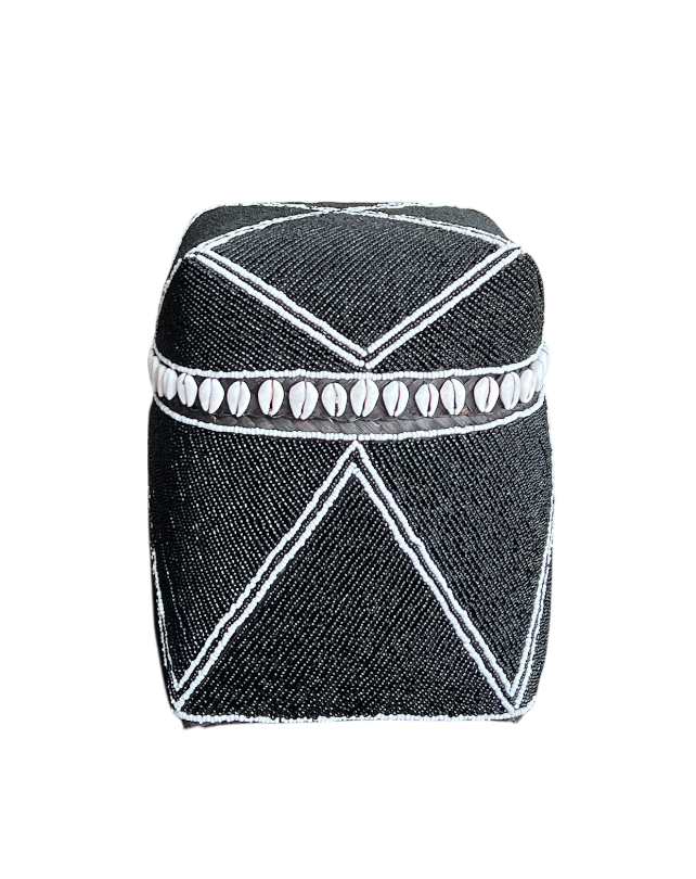 Black and white patterned cylindrical container on a white background