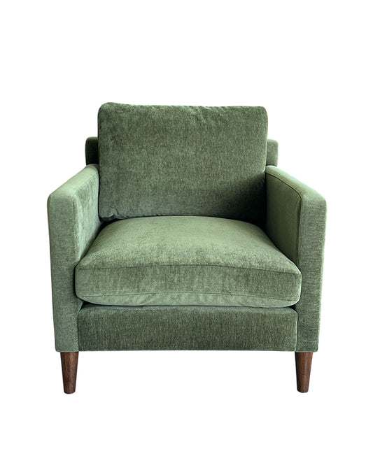 Green armchair on a white background