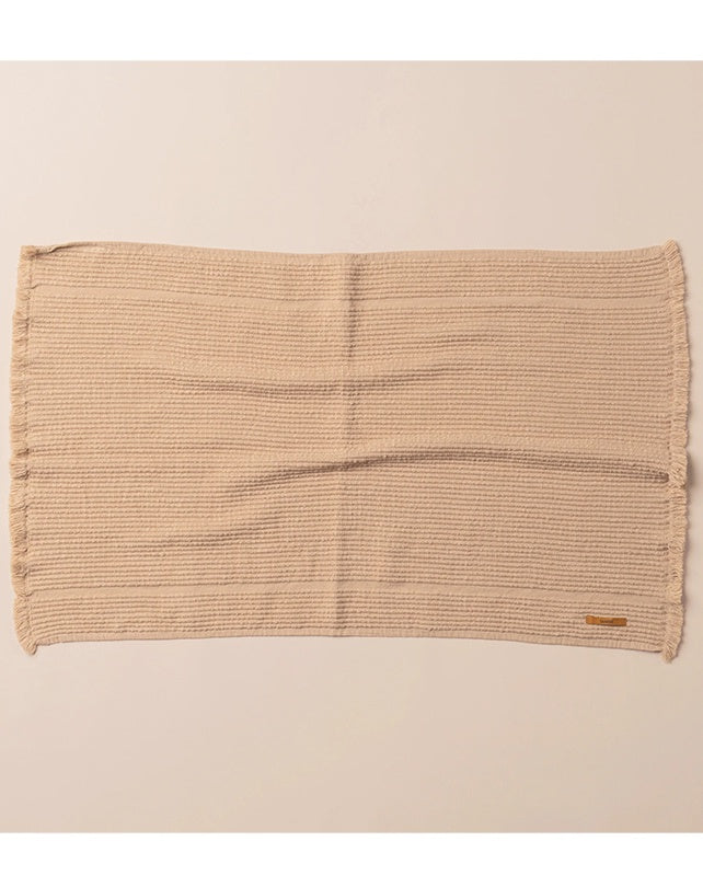 Beige woven placemat on a beige background