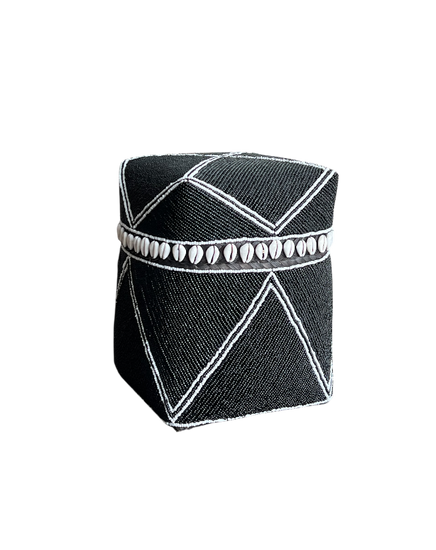 Black geometric-patterned box with white accents on a white background