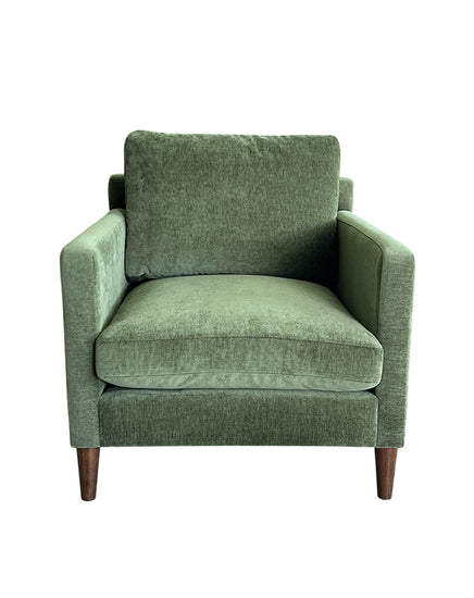 Green armchair on a white background