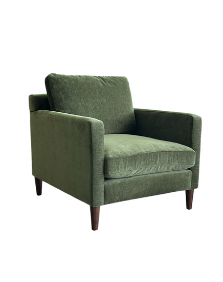 Green armchair on a white background