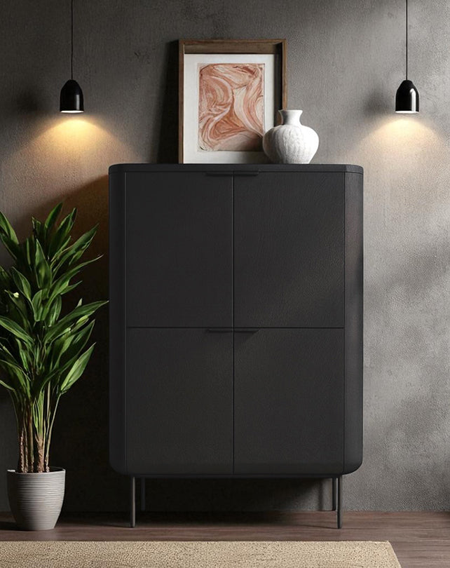 Modern black cabinet with decorative items against a gray wall