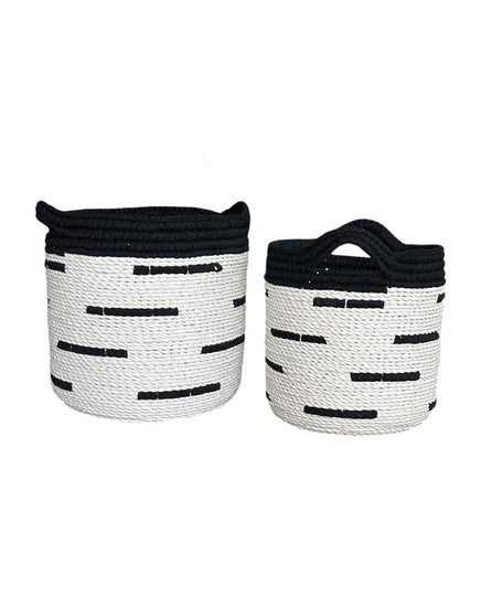 Two woven baskets with black and white pattern on a white background